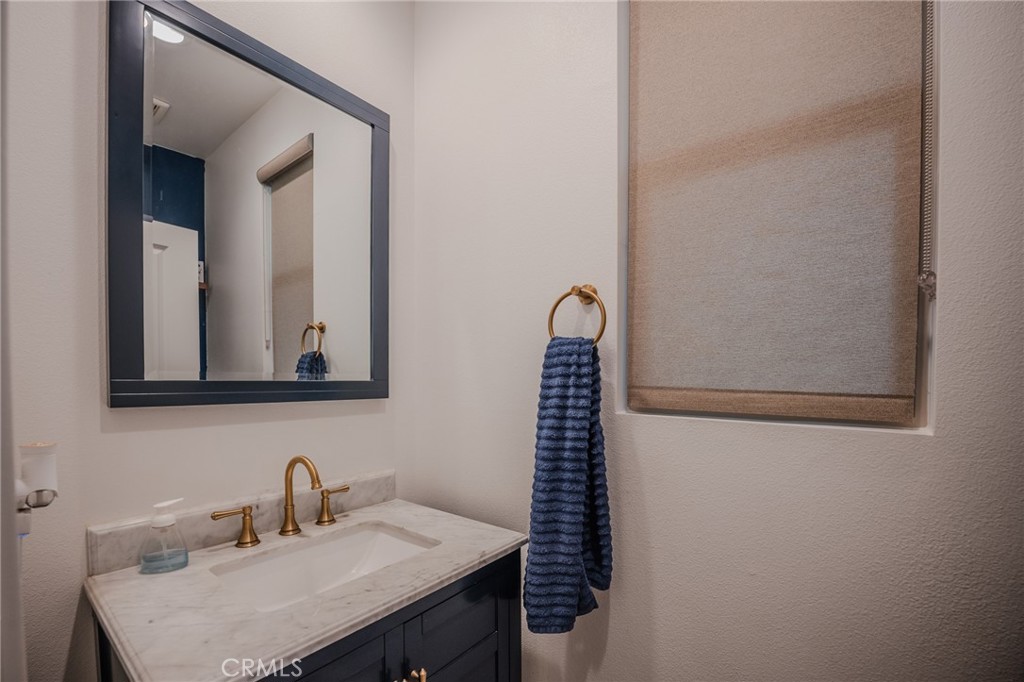 29486 Marx Way Winchester, CA 92596 - Photo 20 of 44 a bathroom with a sink and a mirror