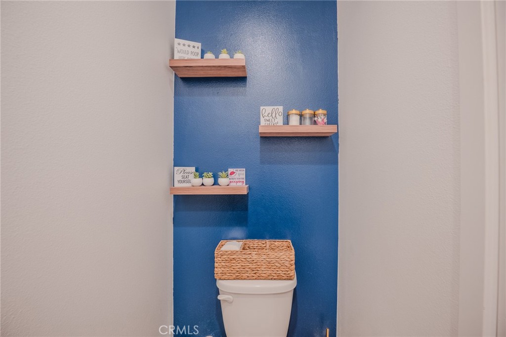 29486 Marx Way Winchester, CA 92596 - Photo 21 of 44 a bathroom with a toilet and a sink