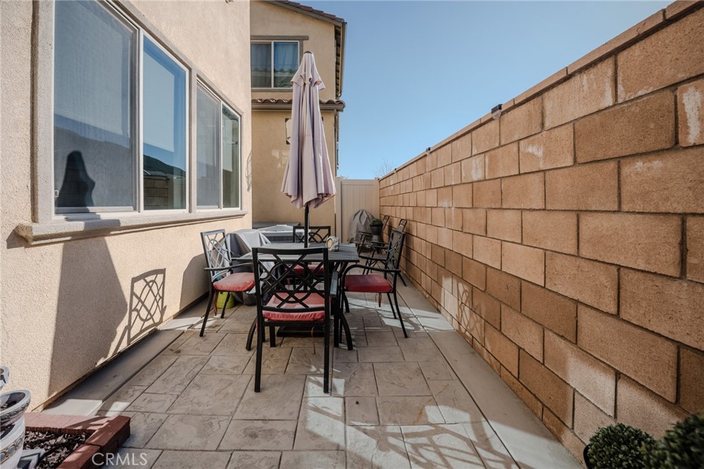 29486 Marx Way Winchester, CA 92596 - Photo 23 of 44 a view of a chairs and table in patio with a backyard