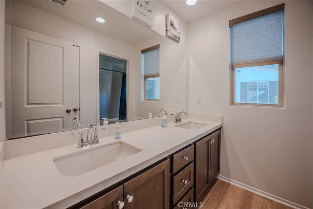 29486 Marx Way Winchester, CA 92596 - Photo 28 of 44 a bathroom with a sink and a mirror