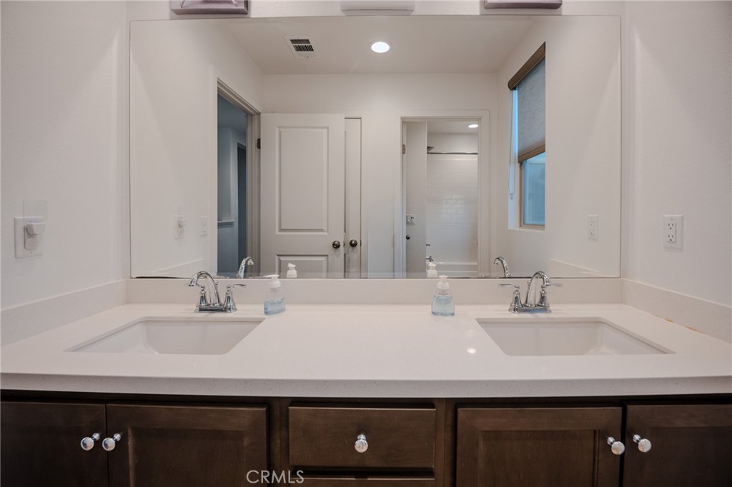 29486 Marx Way Winchester, CA 92596 - Photo 29 of 44 a bathroom with a sink and a mirror