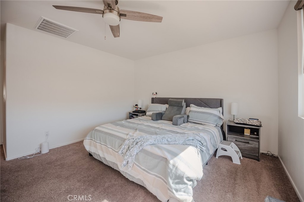 29486 Marx Way Winchester, CA 92596 - Photo 35 of 44 a bedroom with a bed and dresser