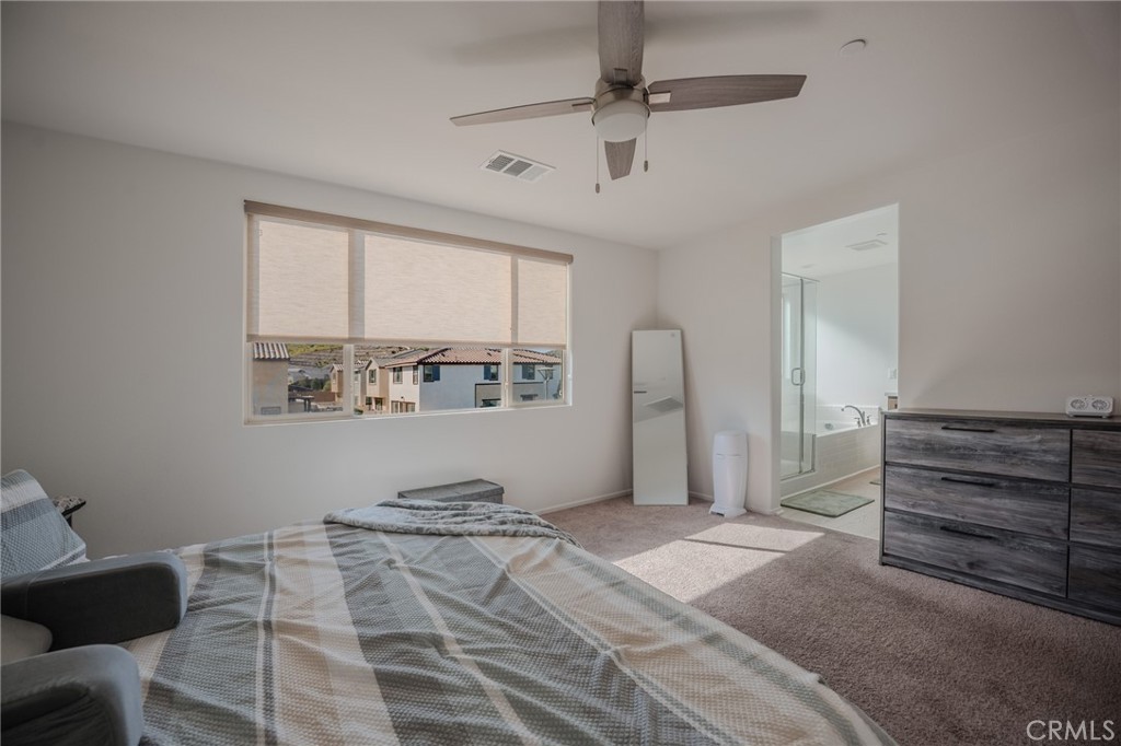 29486 Marx Way Winchester, CA 92596 - Photo 36 of 44 a bedroom with a bed and a window