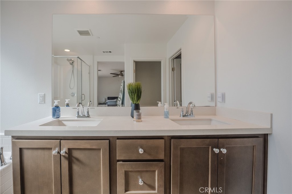 29486 Marx Way Winchester, CA 92596 - Photo 37 of 44 a bathroom with a sink and a mirror