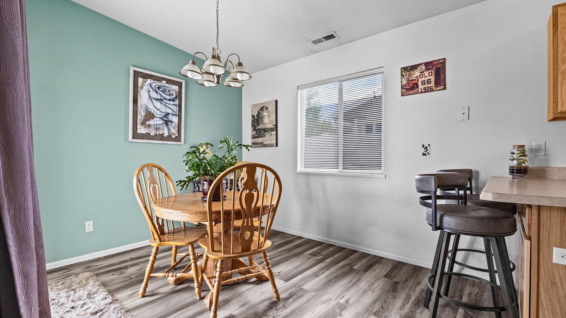 420-29 29 1/2 Road Grand Junction, CO 81504 - Photo 8 of 26 a view of a dining room with furniture window and wooden floor
