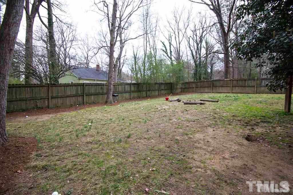 131 Justice Street Chapel Hill, NC 27516 - Photo 9 of 10 a backyard of a house with lots of green space