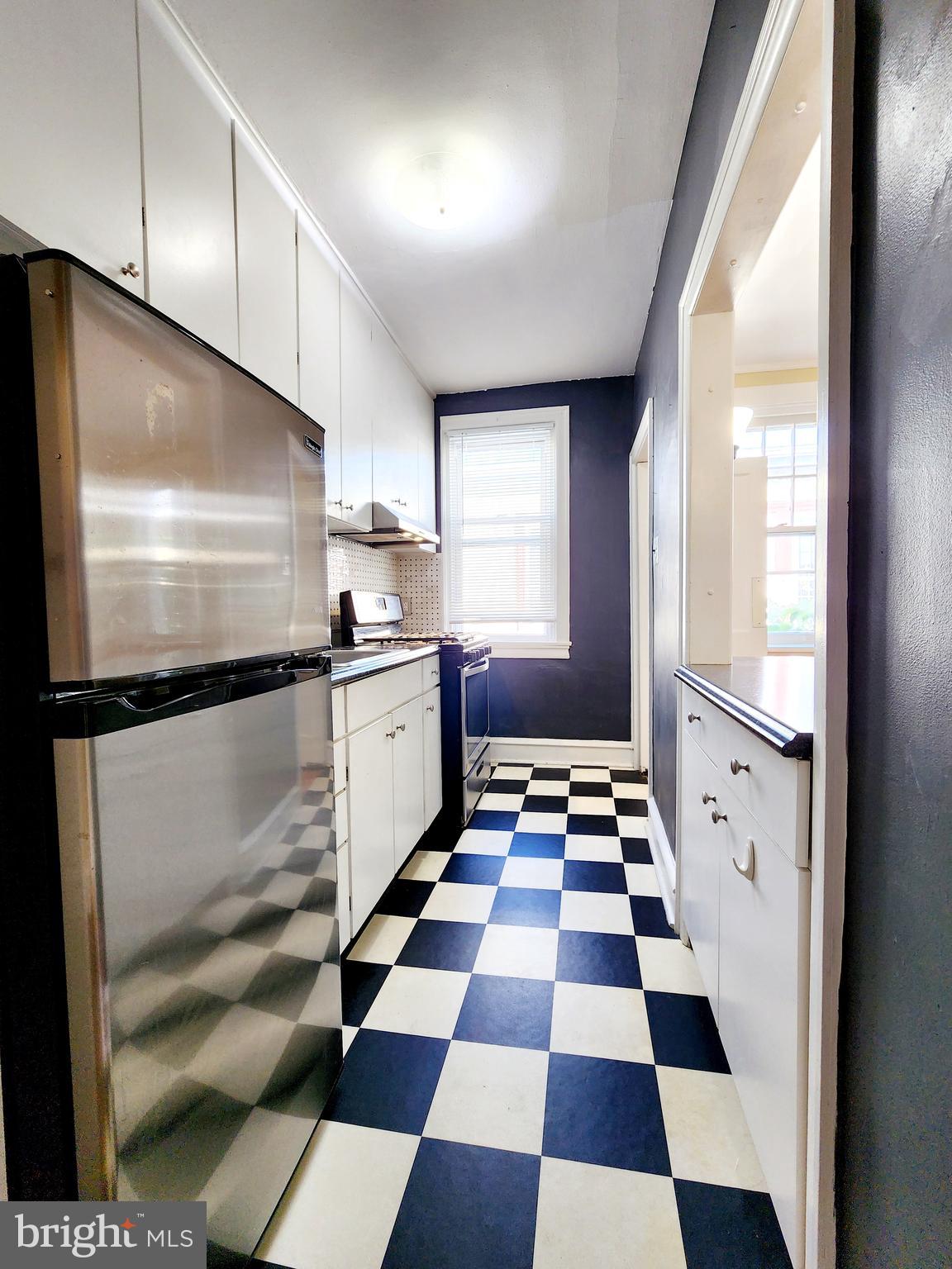 208 West Wayne Avenue Wayne, PA 19087 - Photo 3 of 9 a kitchen with stainless steel appliances and cabinets