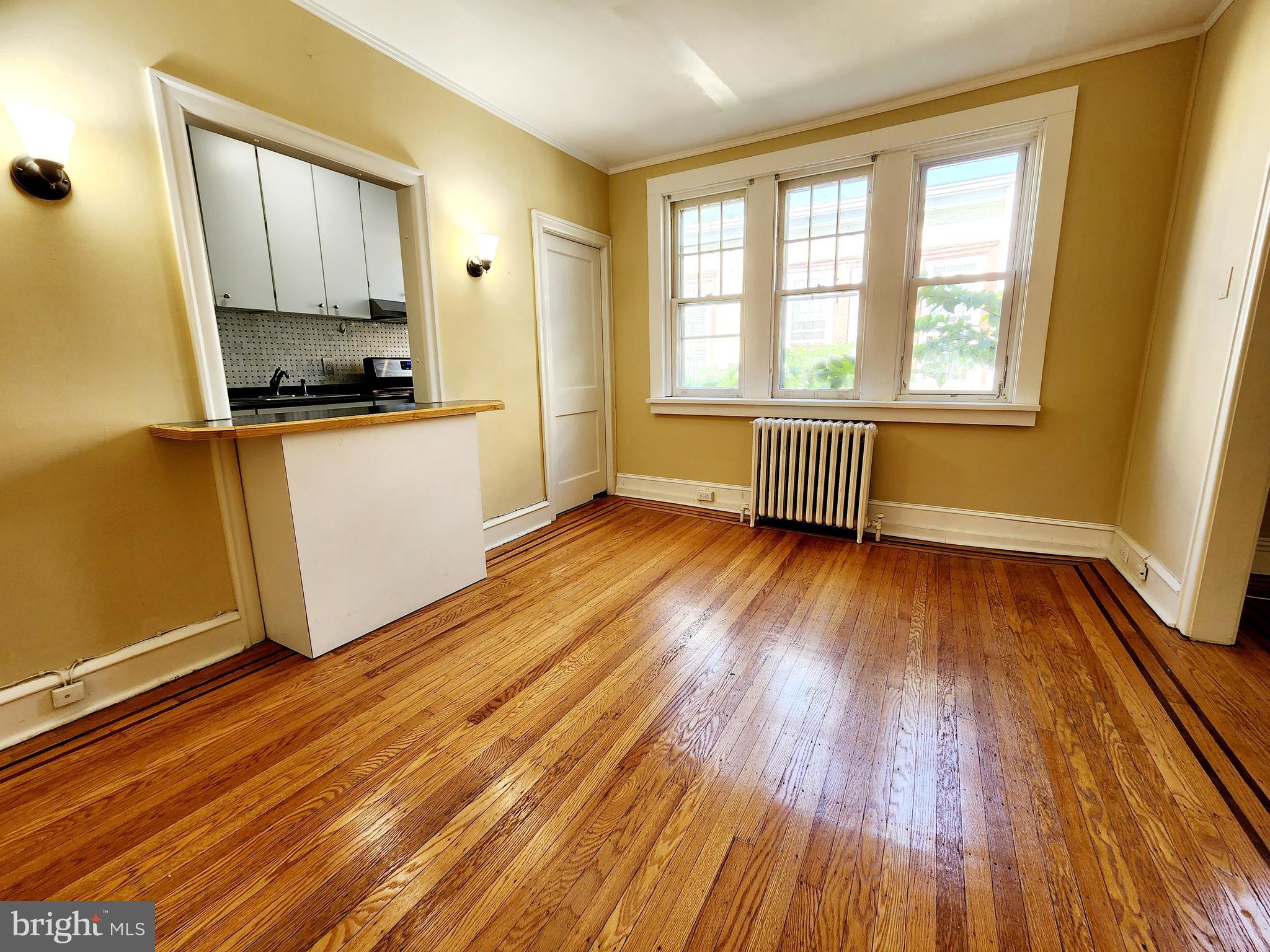 208 West Wayne Avenue Wayne, PA 19087 - Photo 4 of 9 a room with wooden floor and window