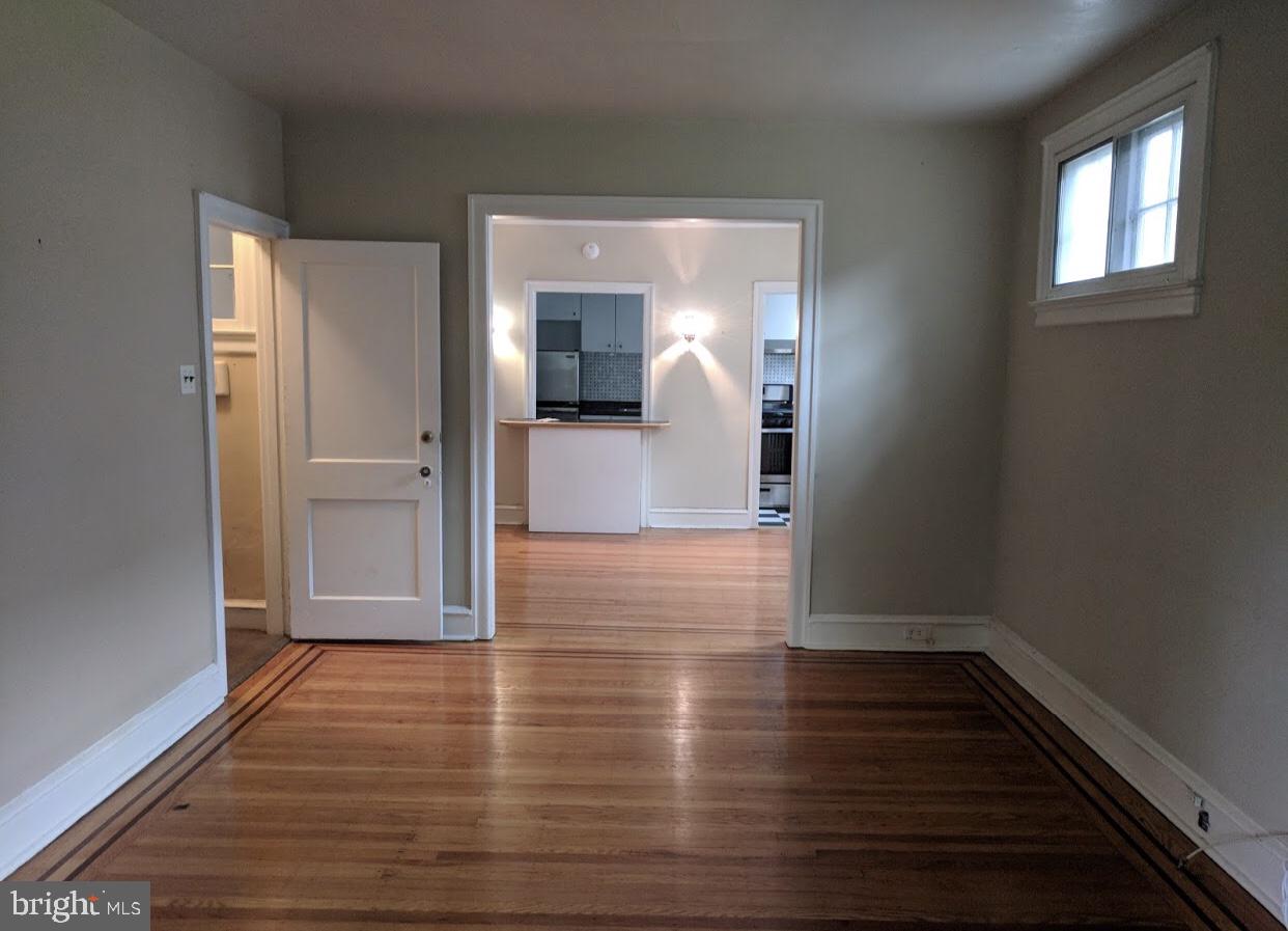 208 West Wayne Avenue Wayne, PA 19087 - Photo 6 of 9 a view of a room with wooden floor and a window