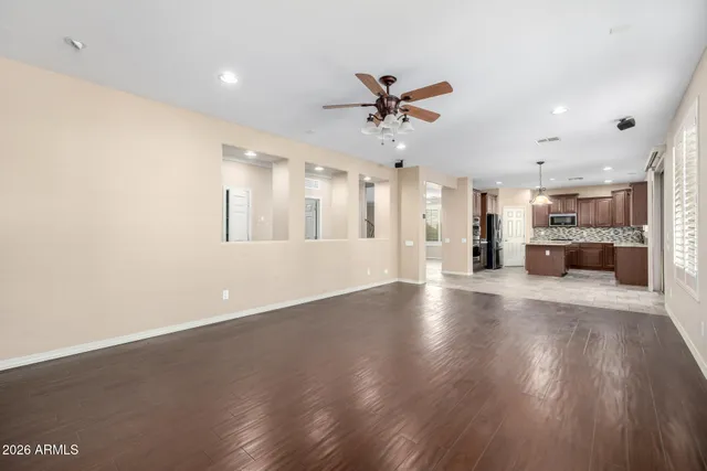 a view of a kitchen with a sink and a stove top oven