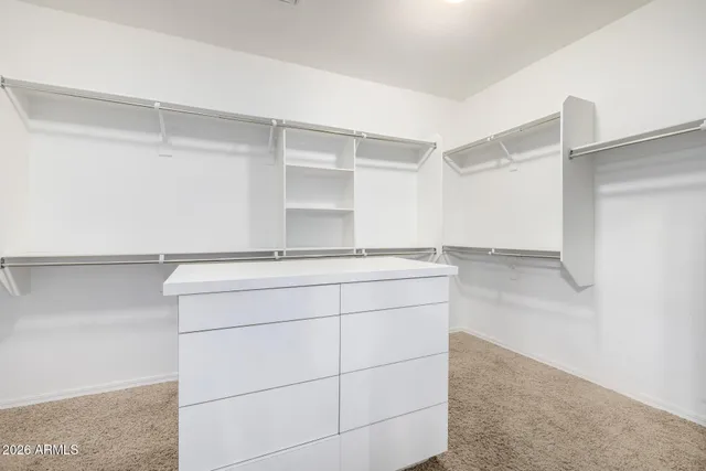 a bathroom with a shower and vanity