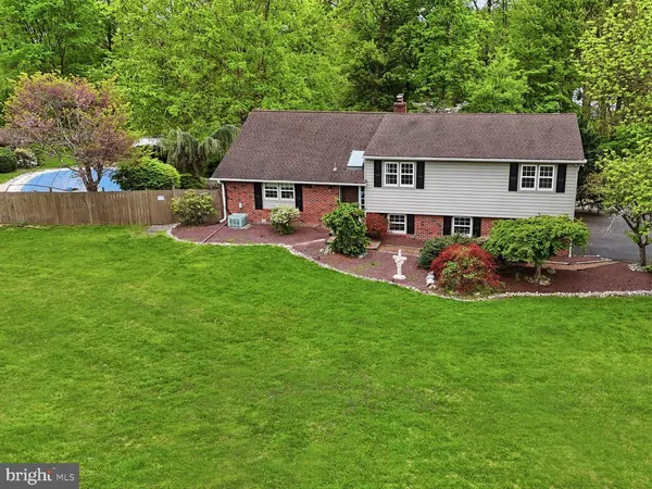 a aerial view of a house with a yard