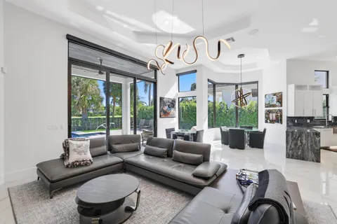 a kitchen with stainless steel appliances kitchen island granite countertop a refrigerator and a stove