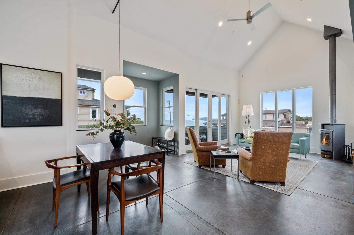100 Coronado Avenue Half Moon Bay, CA 94019 - Photo 11 of 64 a view of a dining room with furniture and wooden floor