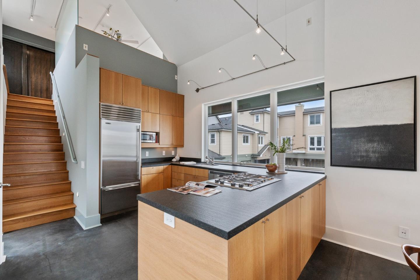 100 Coronado Avenue Half Moon Bay, CA 94019 - Photo 14 of 64 a kitchen with stainless steel appliances granite countertop a sink stove and refrigerator