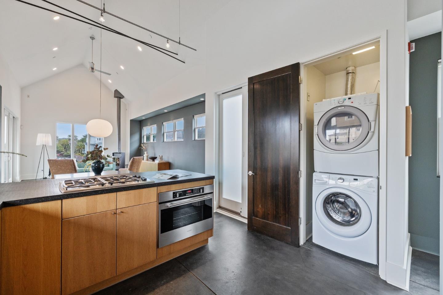 100 Coronado Avenue Half Moon Bay, CA 94019 - Photo 17 of 64 a kitchen with kitchen island and a stove top oven