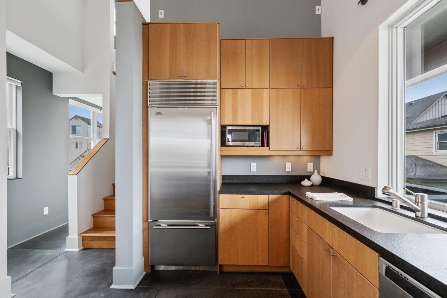 100 Coronado Avenue Half Moon Bay, CA 94019 - Photo 19 of 64 a kitchen with a refrigerator and a sink