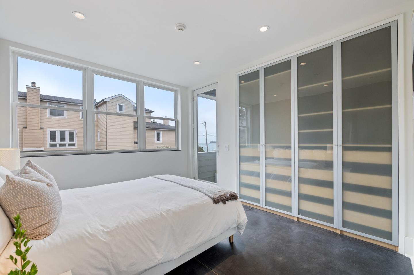 100 Coronado Avenue Half Moon Bay, CA 94019 - Photo 28 of 64 a bedroom with a bed and a walk in closet