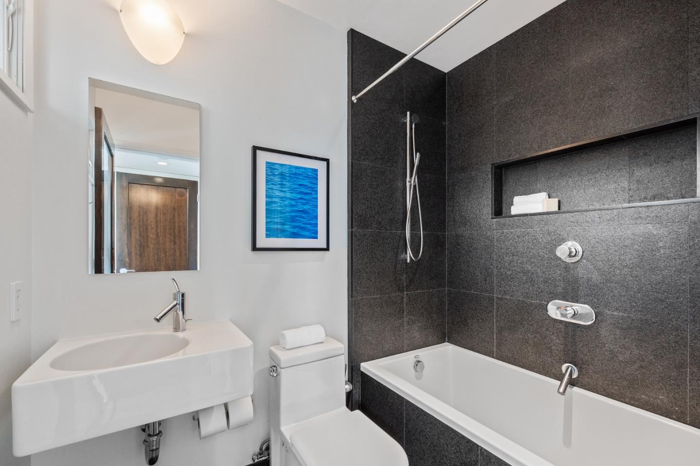 100 Coronado Avenue Half Moon Bay, CA 94019 - Photo 34 of 64 a bathroom with a toilet a sink and mirror