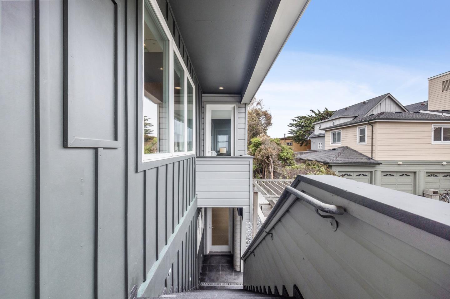 100 Coronado Avenue Half Moon Bay, CA 94019 - Photo 42 of 64 a view of balcony with stainless steel appliances wooden floor and seating