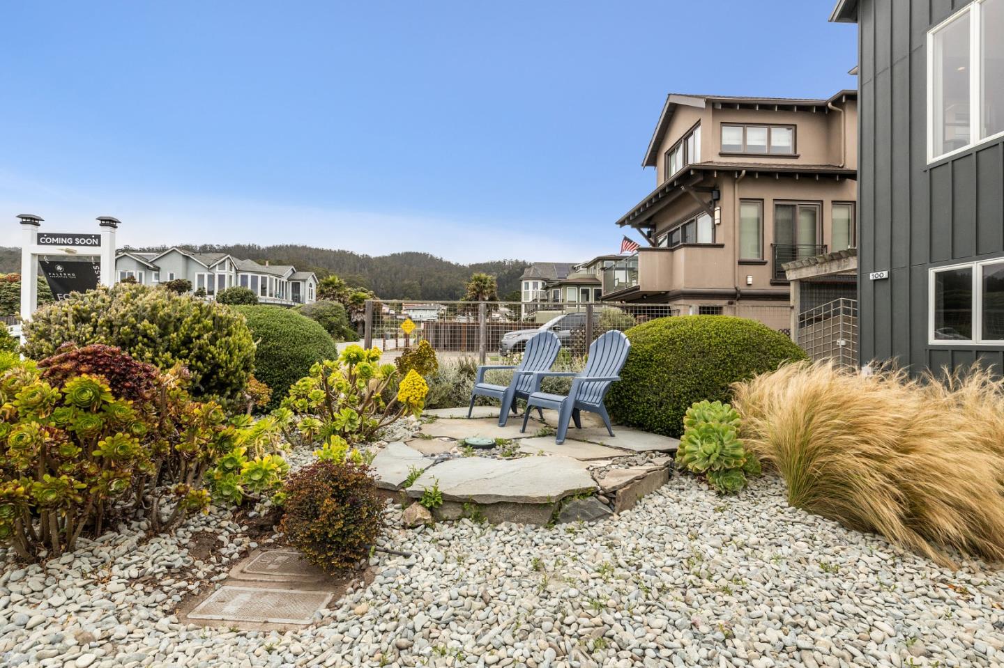 100 Coronado Avenue Half Moon Bay, CA 94019 - Photo 50 of 64 a view of a white house with a yard and sitting area