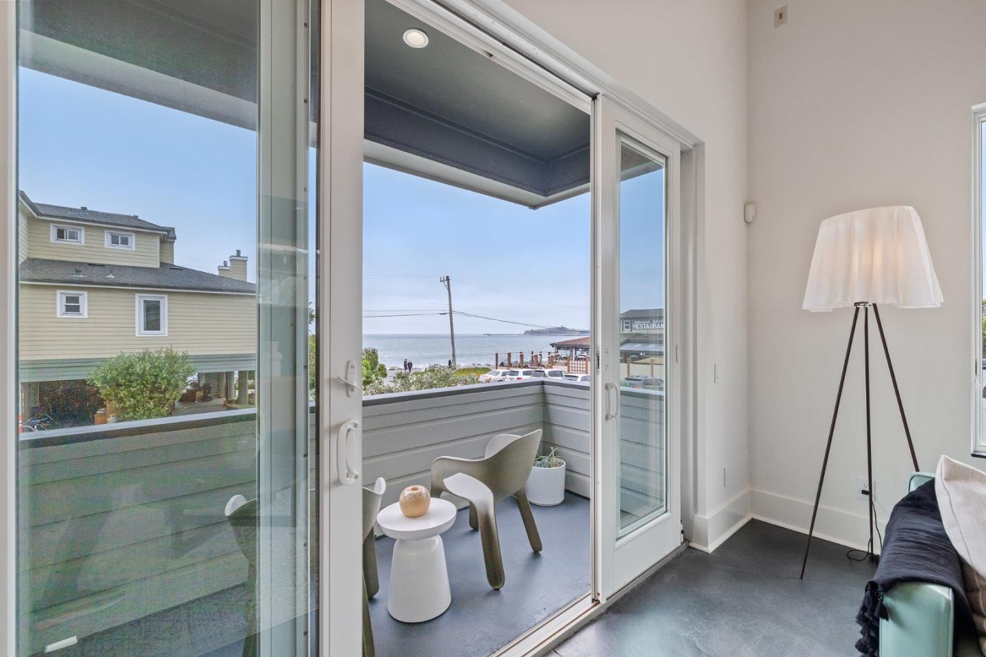 100 Coronado Avenue Half Moon Bay, CA 94019 - Photo 9 of 64 a bedroom with a bed and a window