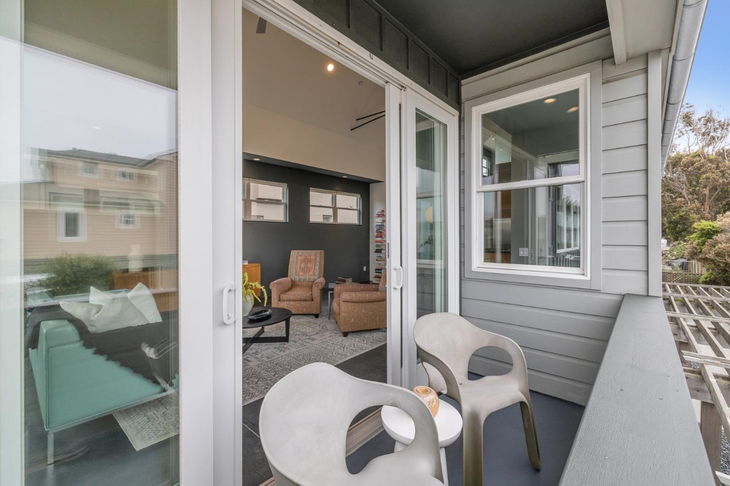 100 Coronado Avenue Half Moon Bay, CA 94019 - Photo 10 of 64 a view of a house with a chairs and table in a patio