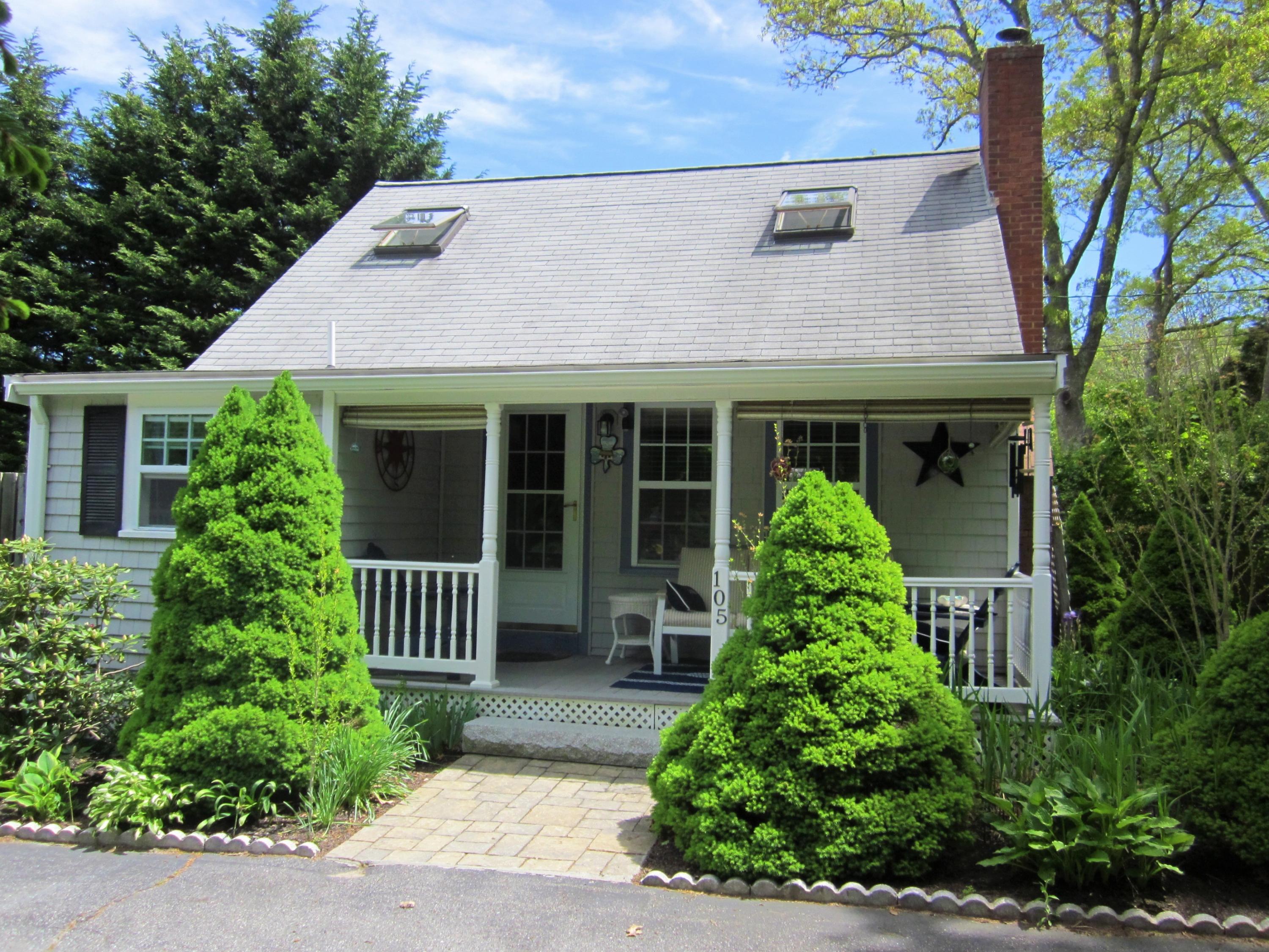 105 Sandwich Road Bourne, MA 02532 - Photo 1 of 19 front view of a house with a yard