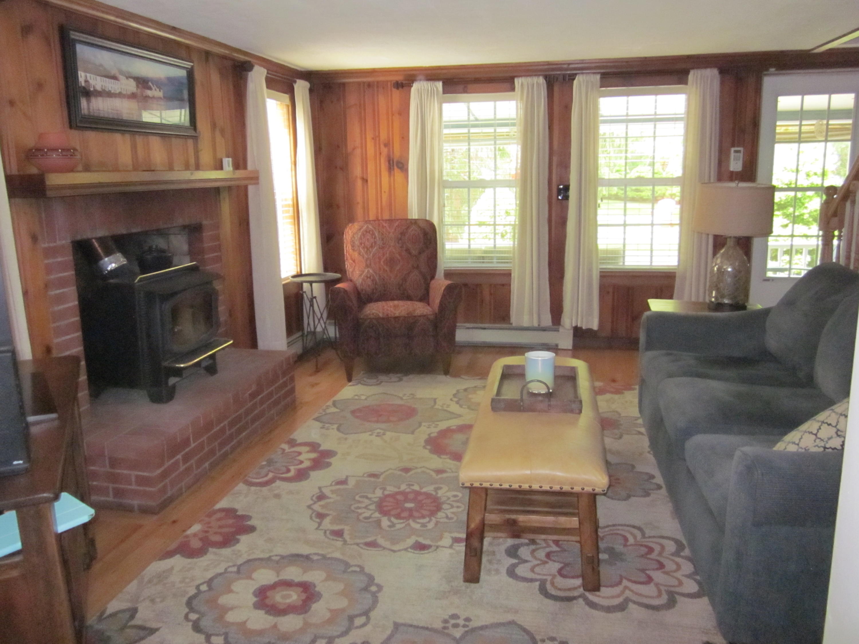 105 Sandwich Road Bourne, MA 02532 - Photo 12 of 19 a living room with furniture a fireplace and a window