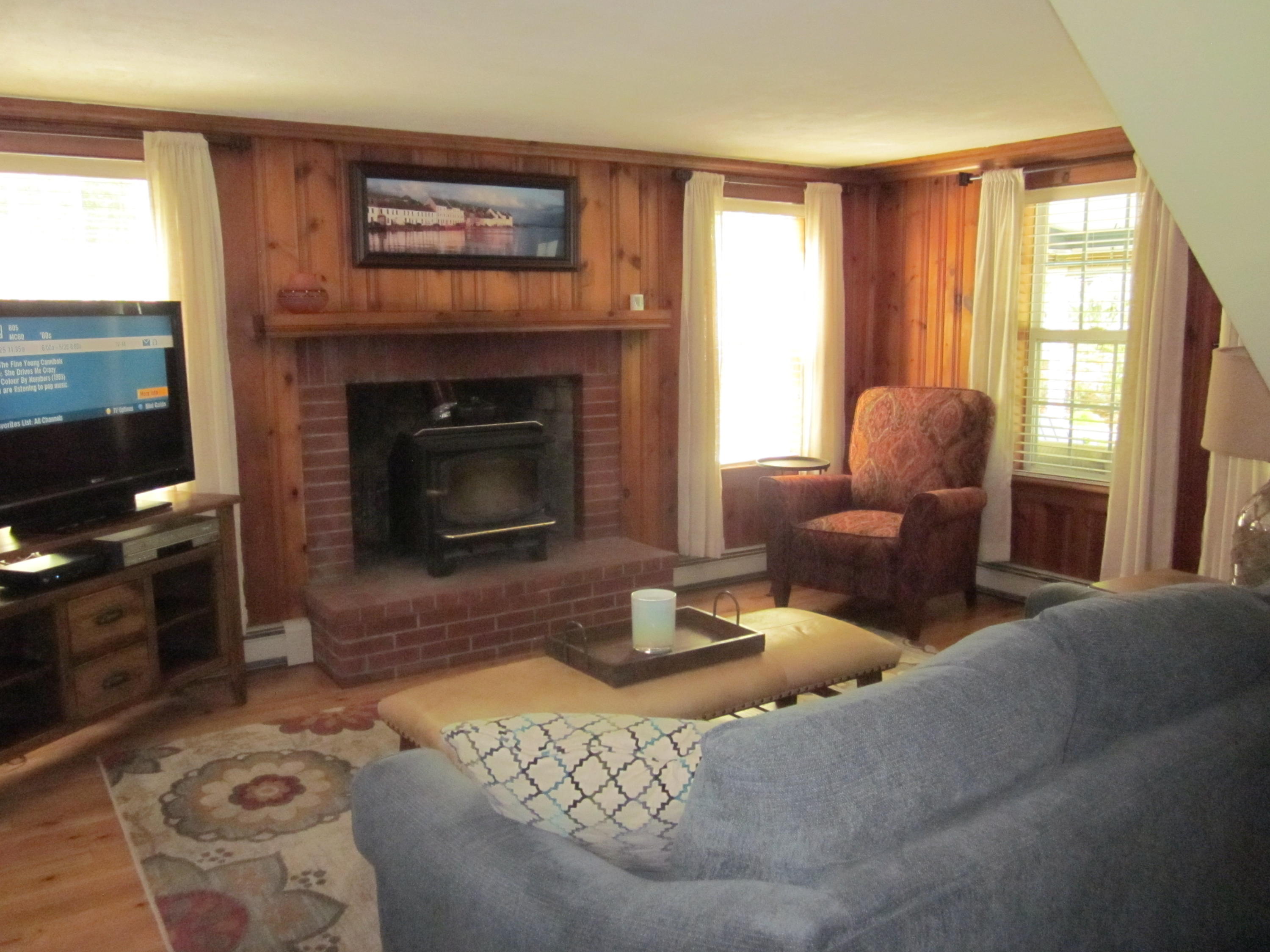 105 Sandwich Road Bourne, MA 02532 - Photo 13 of 19 a living room with furniture and a fireplace