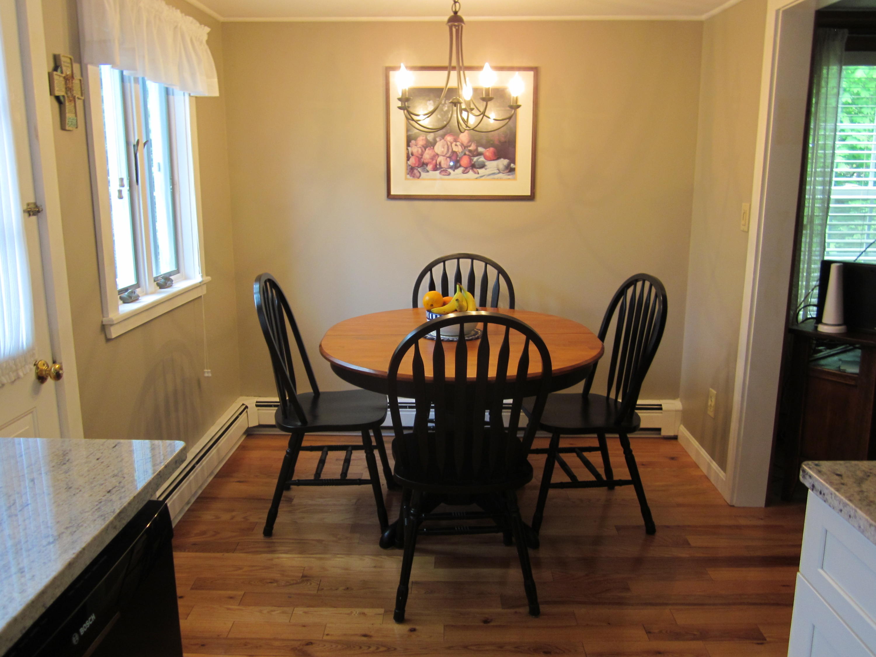 105 Sandwich Road Bourne, MA 02532 - Photo 14 of 19 a view of a dining room with furniture and wooden floor