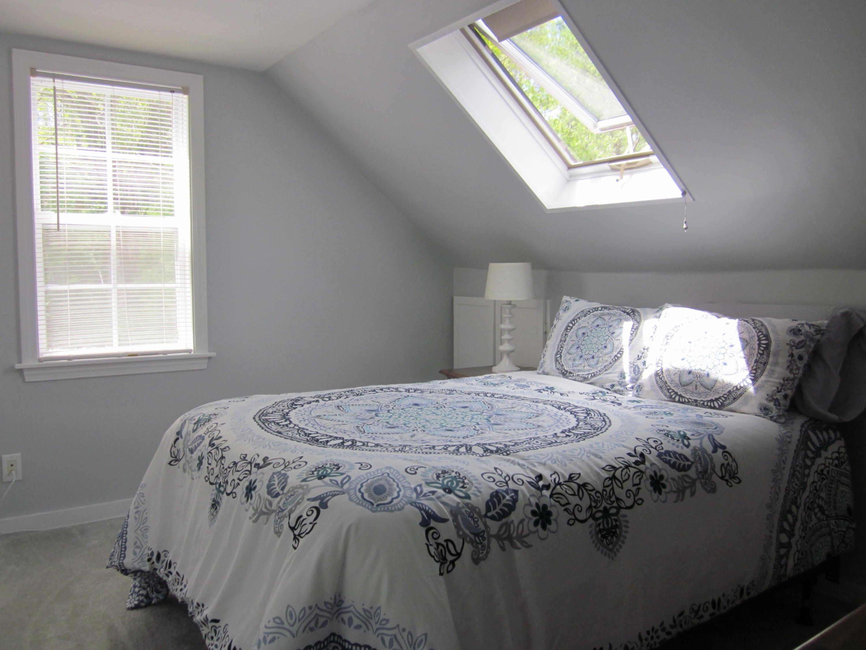 105 Sandwich Road Bourne, MA 02532 - Photo 16 of 19 a bedroom with a bed next to a window