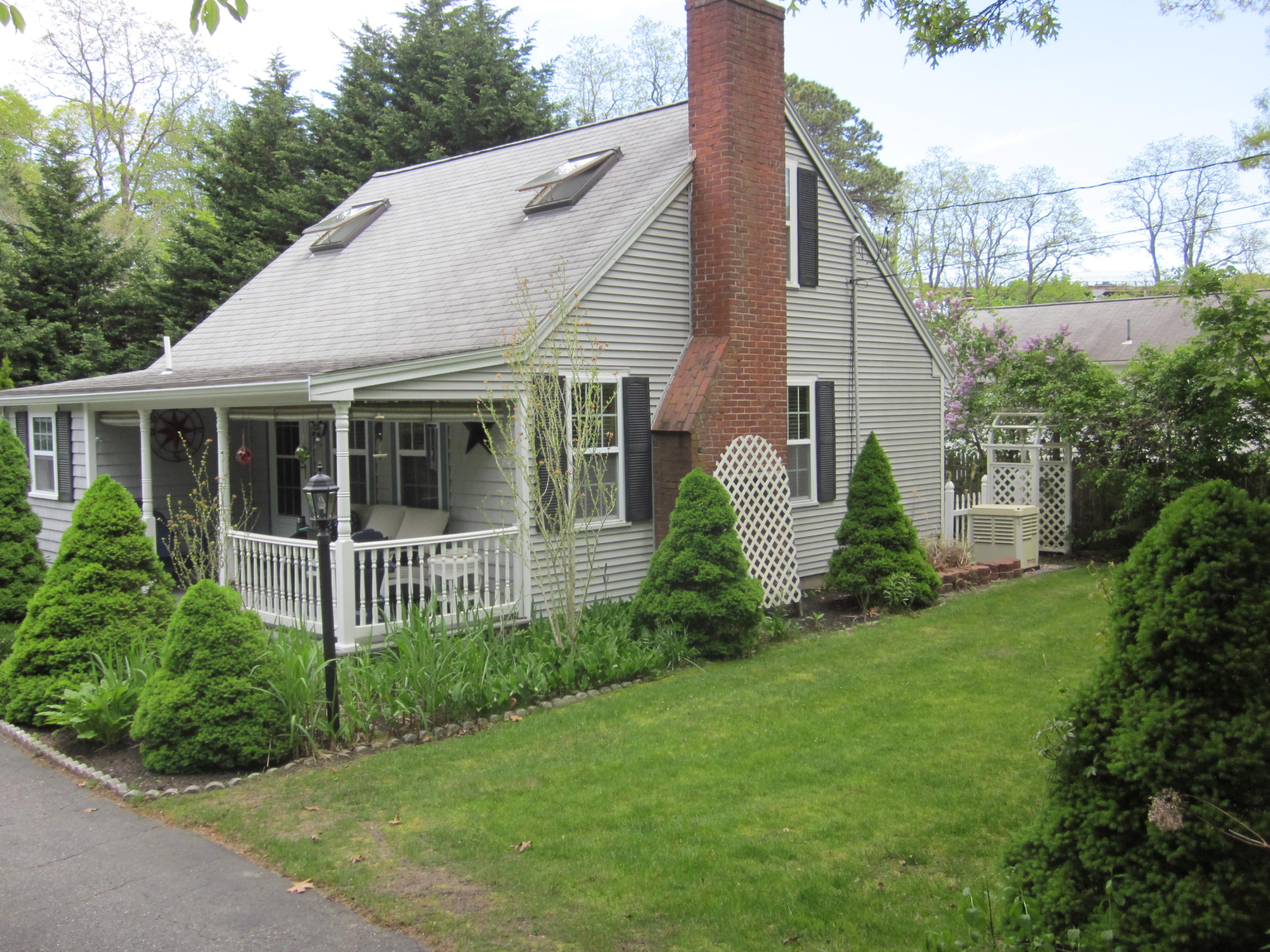 105 Sandwich Road Bourne, MA 02532 - Photo 4 of 19 a view of a house with backyard