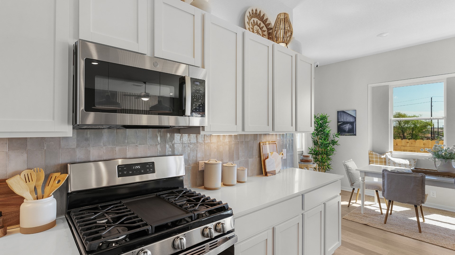 25812 Jasmine Sprig Lane Elgin, TX 78621 - Photo 8 of 33 Culinary delights await in this bright kitchen with modern appliances and abundant storage.