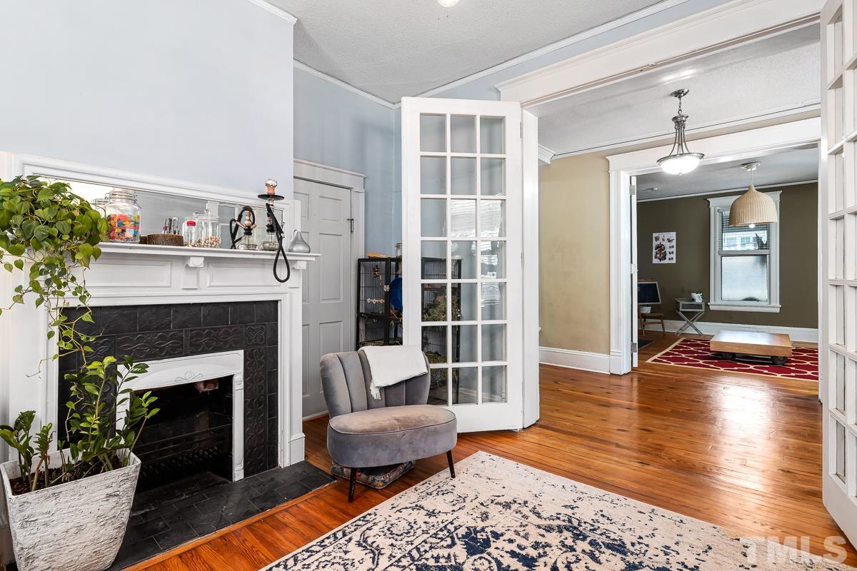 415 New Bern Avenue Raleigh, NC 27601 - Photo 13 of 54 a living room with furniture and a fireplace