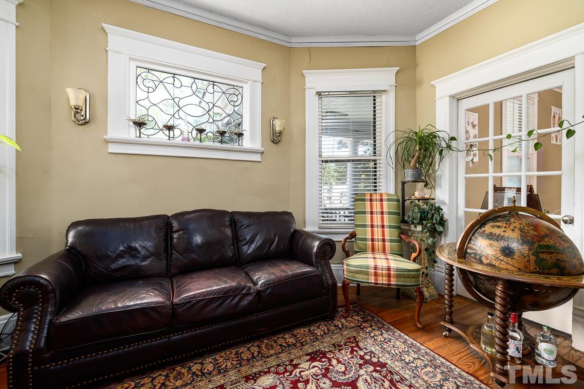 415 New Bern Avenue Raleigh, NC 27601 - Photo 20 of 54 a living room with furniture and a window