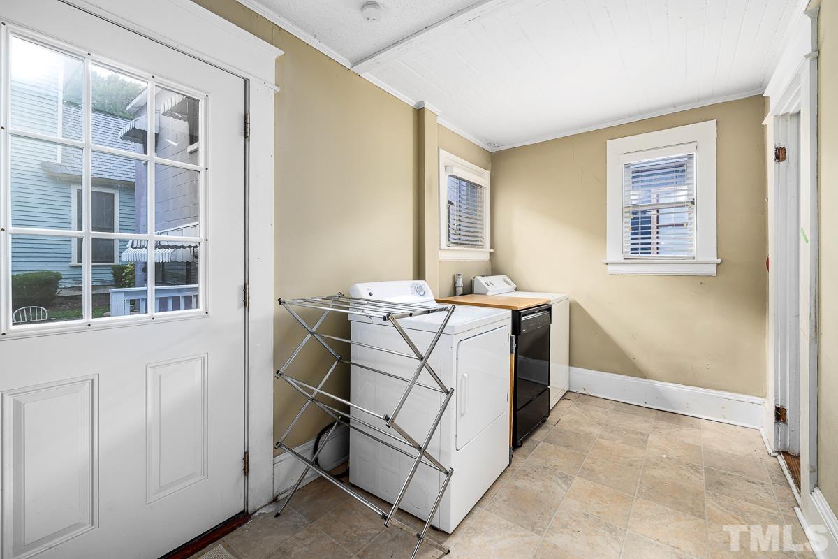 415 New Bern Avenue Raleigh, NC 27601 - Photo 24 of 54 a bathroom with a sink a mirror and a window
