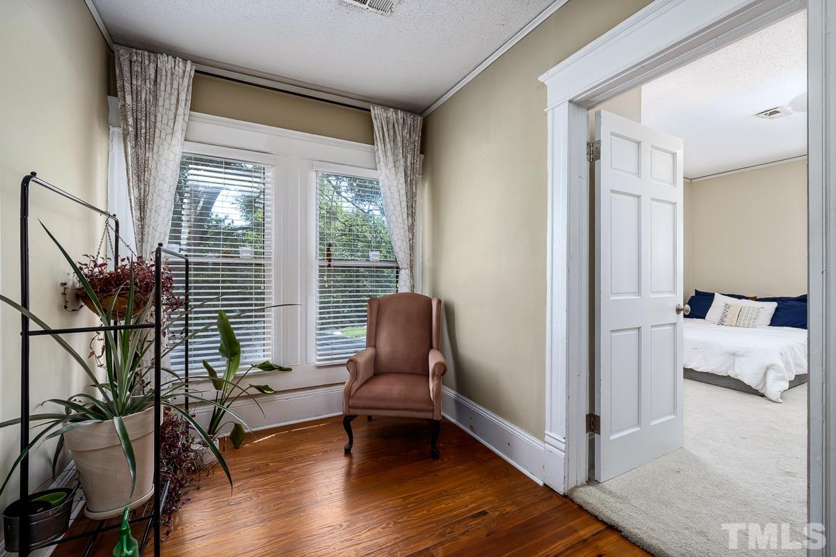 415 New Bern Avenue Raleigh, NC 27601 - Photo 30 of 54 a living room with furniture and a window