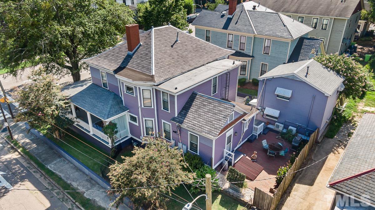 415 New Bern Avenue Raleigh, NC 27601 - Photo 3 of 54 an aerial view of a house with balcony and trees