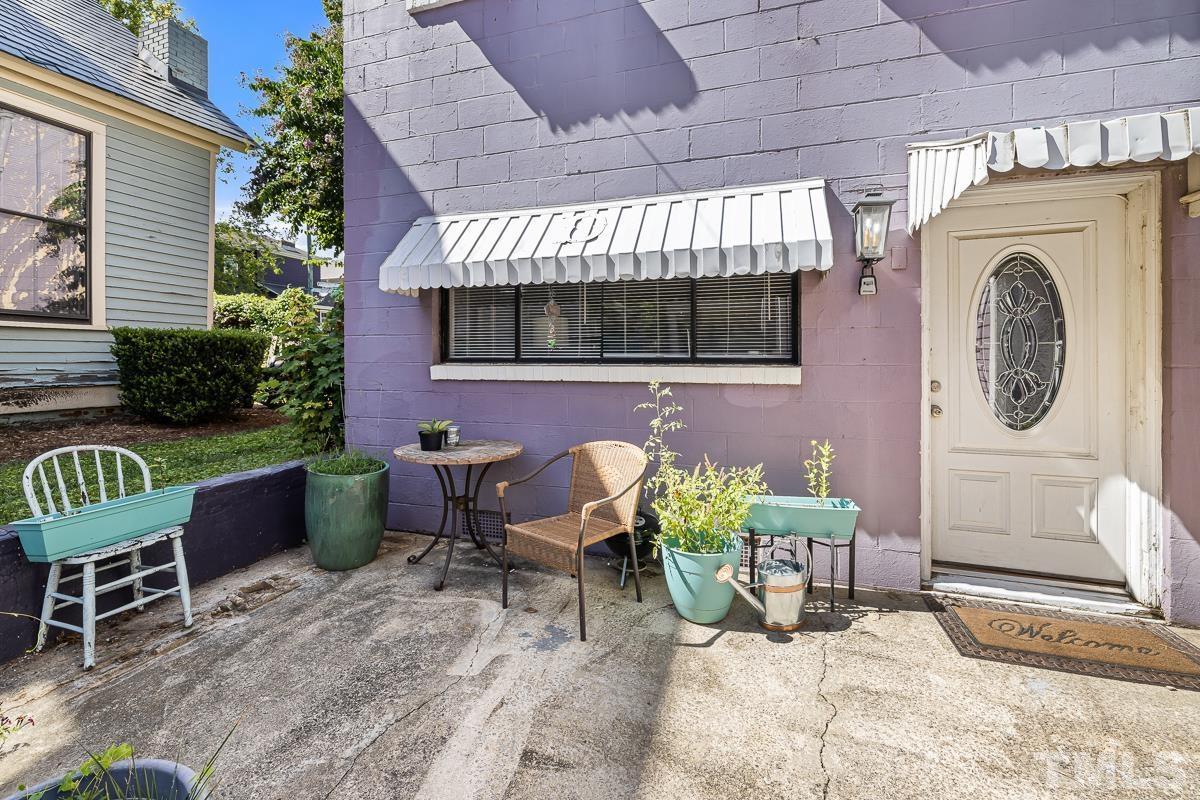 415 New Bern Avenue Raleigh, NC 27601 - Photo 52 of 54 a building outdoor space with patio furniture and potted plants