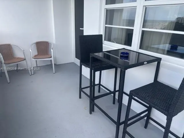 a view of a workspace with furniture