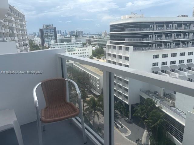 100 Lincoln Road, Unit 1243 Miami Beach, FL 33139 - Photo 12 of 29 a balcony with a bench and city view