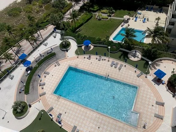 an aerial view of a house with a swimming pool