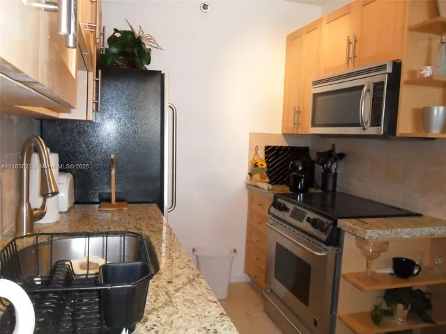 a kitchen with a stove and a microwave