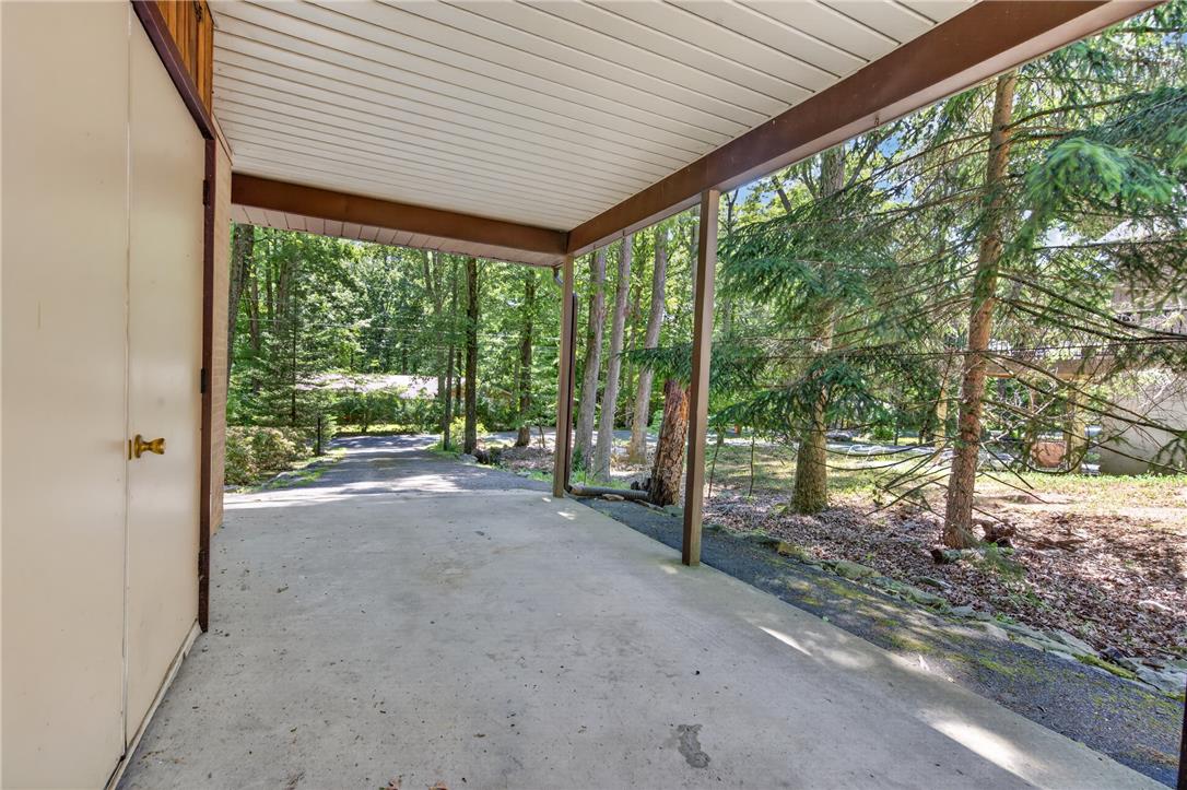 18 White Oak Road Nesquehoning, PA 18240 - Photo 37 of 52 A private covered carport provides sheltered parking, nestled amongst mature trees and a tranquil wooded setting.