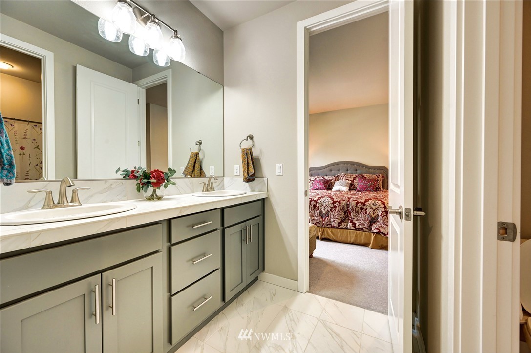 3406 216th Place Southeast Bothell, WA 98021 - Photo 22 of 30 a en suite bathroom with 2 sink and a mirror