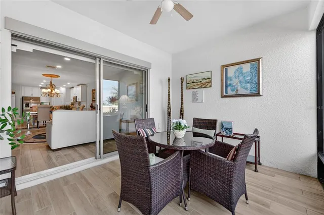 a dining room with furniture and wooden floor