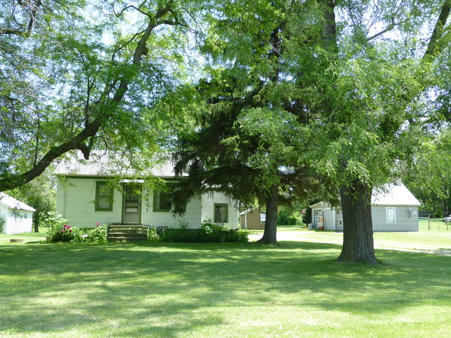 14411 Smith Road Lockport, IL 60441 - Photo 2 of 13 a front view of a house with a garden