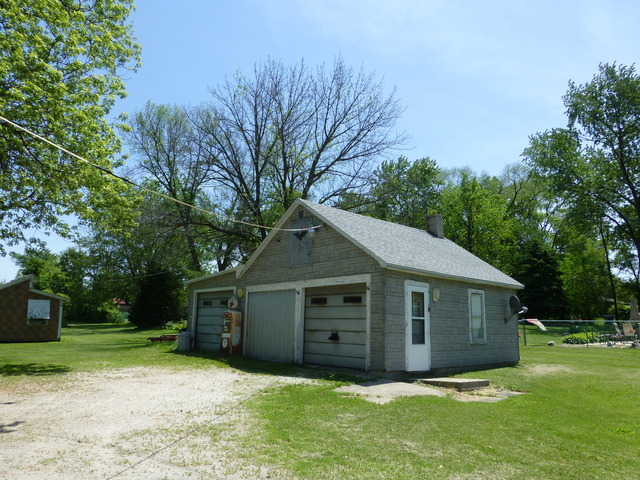 14411 Smith Road Lockport, IL 60441 - Photo 4 of 13 a front view of house with yard and trees in the background