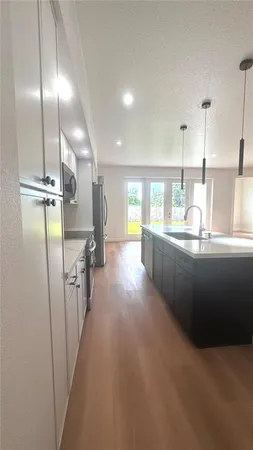 a view of a kitchen with a sink